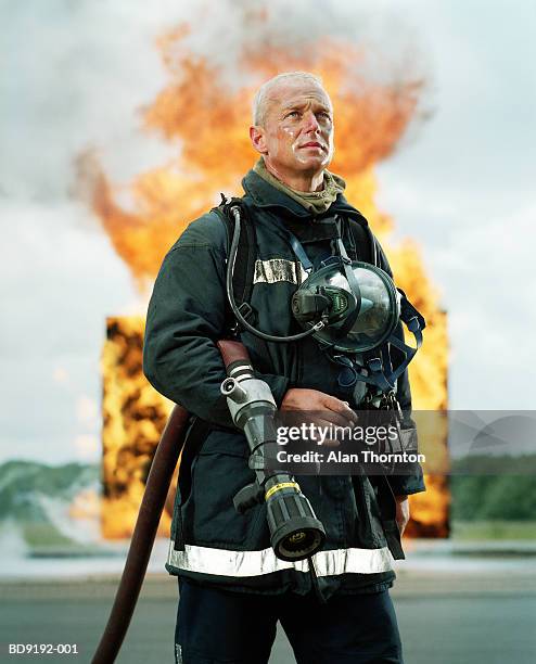 fireman with hose in front of firewall - braveheart bildbanksfoton och bilder