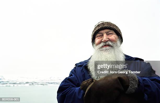 mature man with white beard smiling, outside, close-up - scandinavian descent ストックフォトと画像