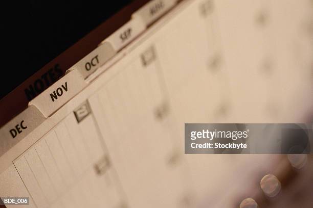calendar with tabs for each month - tabs stockfoto's en -beelden