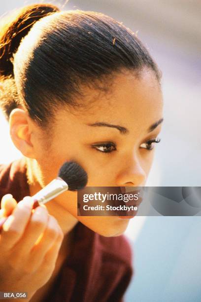 woman applying blush with brush - blusher brush stock pictures, royalty-free photos & images