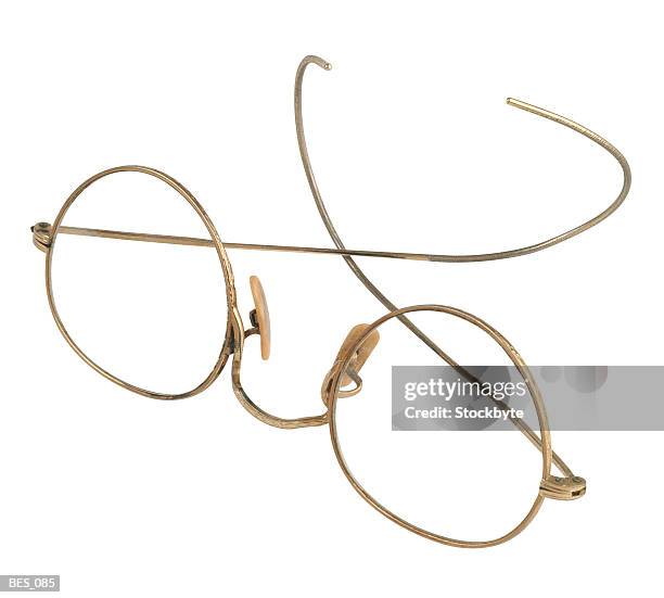 pair of vintage eyeglasses with wire frames - granny glasses stockfoto's en -beelden