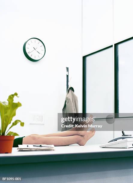 female executive in office, resting  bare feet on desk, low section - sole of foot stock pictures, royalty-free photos & images