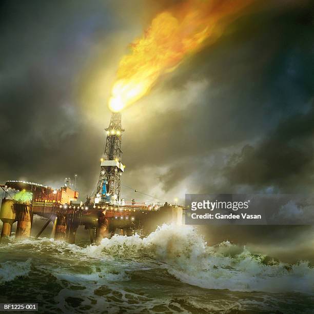 north sea oil rig on stormy night (digital composite) - plattform stock-fotos und bilder
