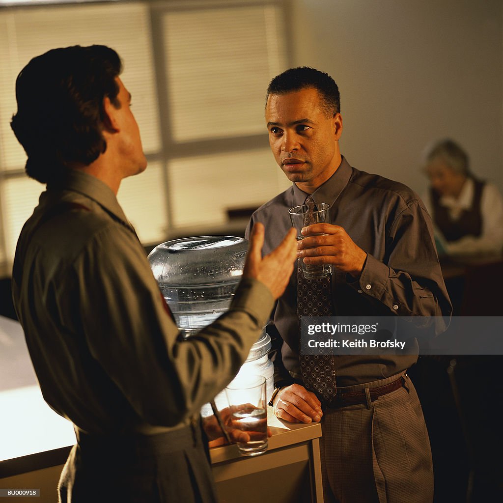 Businessmen Talking at Water Cooler