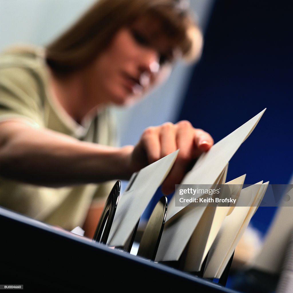 Woman Filing Letter