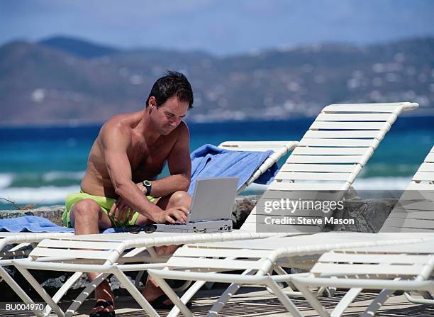 frustrated businessman on vacation - computer rage stock pictures, royalty-free photos & images