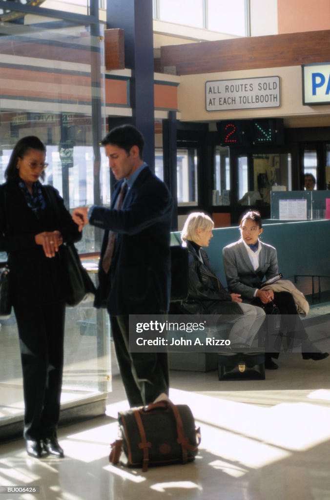 Businesspeople Waiting in Ferry Terminal