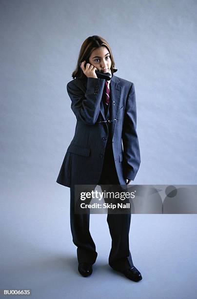 businessgirl talking on cellular phone - adult imitation stock pictures, royalty-free photos & images