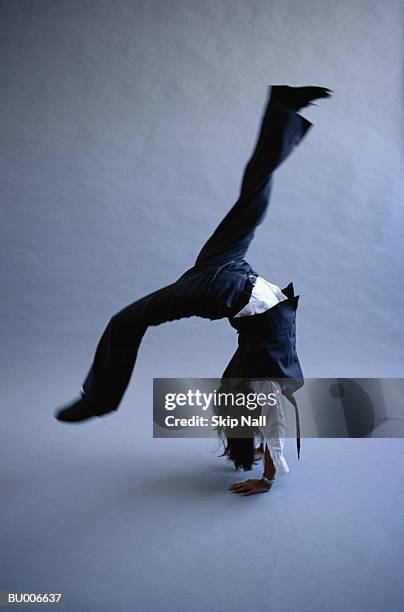 businessgirl turning backflip - adult imitation stock pictures, royalty-free photos & images