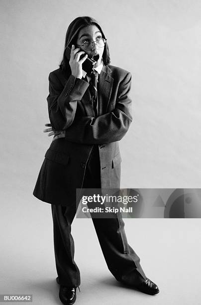 businessgirl on cellular phone - adult imitation stock pictures, royalty-free photos & images