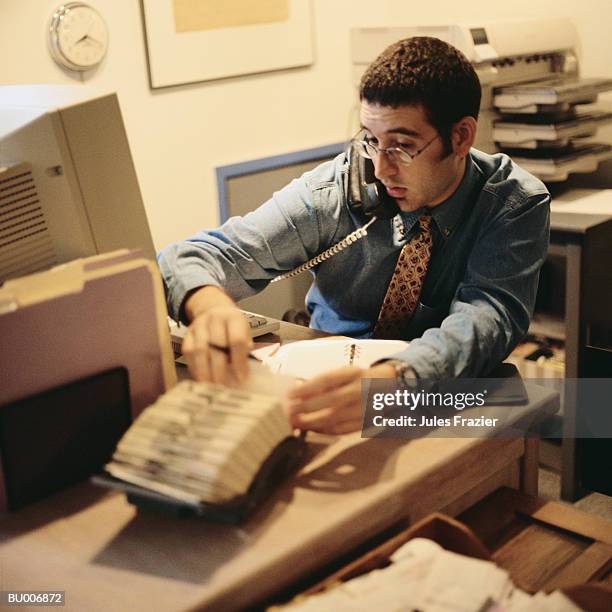 businessman searching through rotary file - searching for something ストックフォトと画像