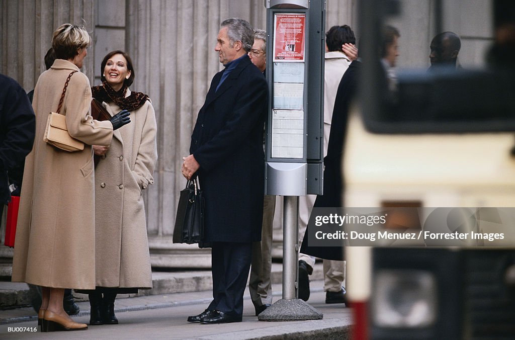 Businesspeople at Bus Stop