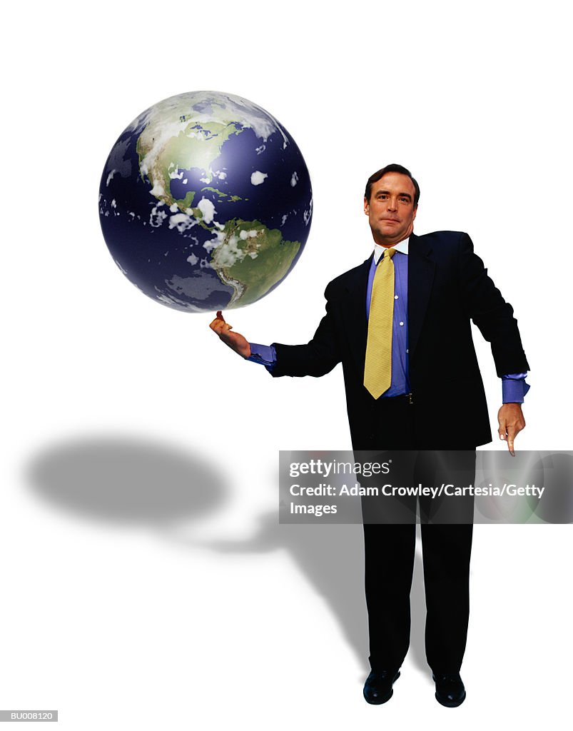 Businessman Balancing Globe