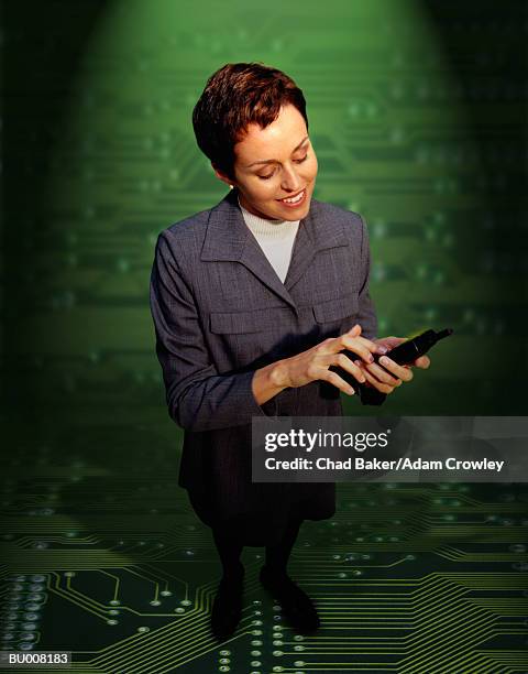 businesswoman against circuit board - wap stockfoto's en -beelden