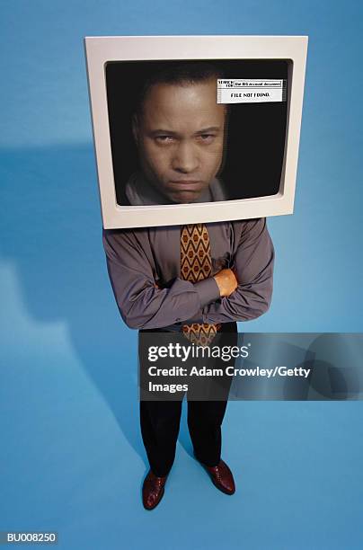 businessman with his head in computer monitor - computer rage stock pictures, royalty-free photos & images