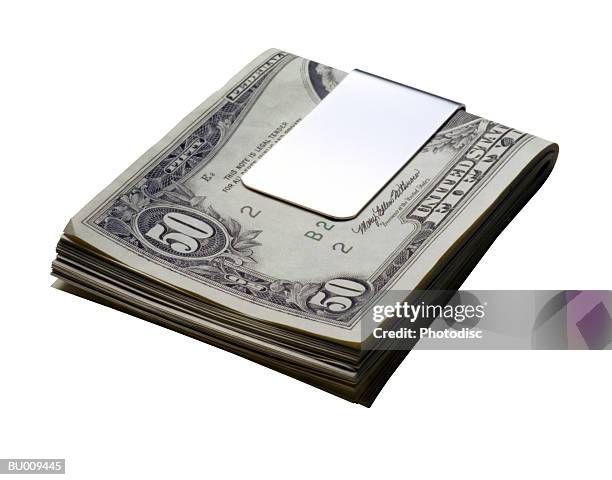 money in money clip - money clip stock pictures, royalty-free photos & images