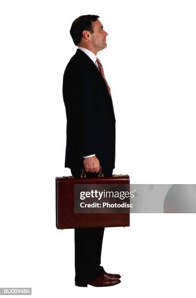 businessman standing with briefcase - buisnessman studio clipping path bildbanksfoton och bilder