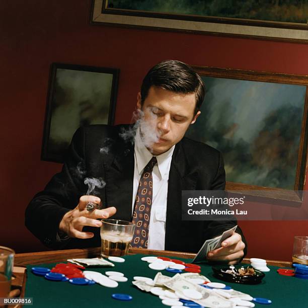 businessman at card table - card table stock pictures, royalty-free photos & images