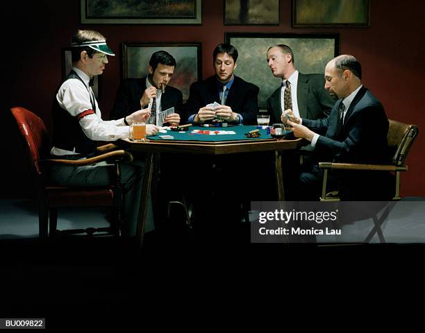 businessmen at card table - card table stock pictures, royalty-free photos & images