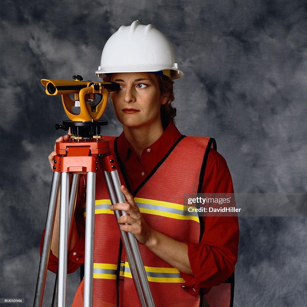 Surveyor Looking Through a Transit