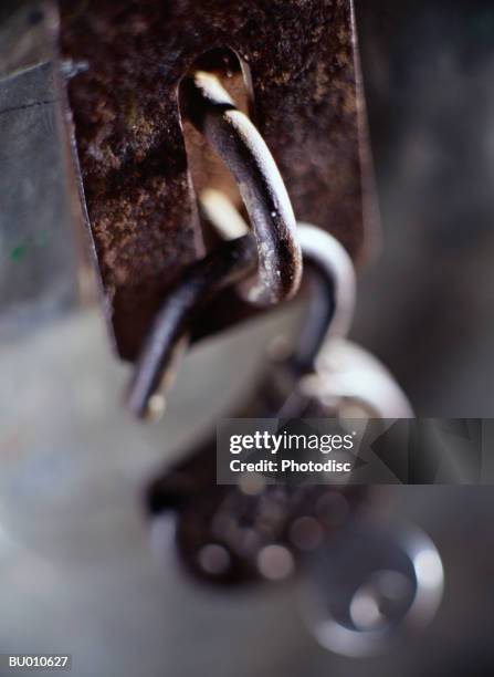 open padlock hanging from a latch - latch stock pictures, royalty-free photos & images