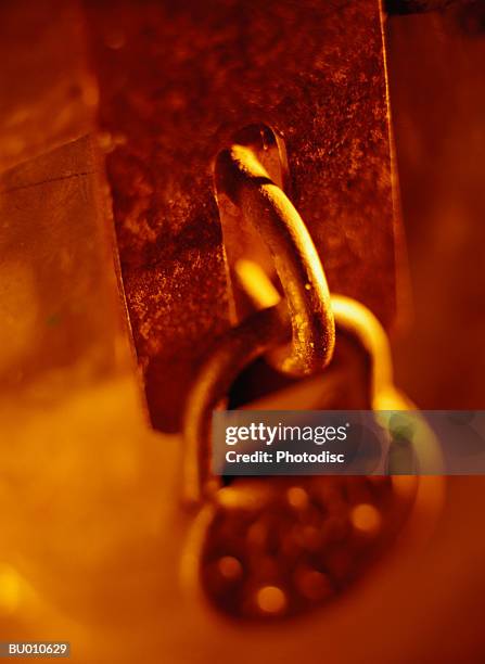 padlock hanging from a latch - latch stock-fotos und bilder