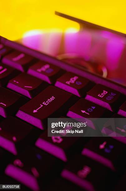 laptop computer keyboard and compact disc - yellow skip stock pictures, royalty-free photos & images