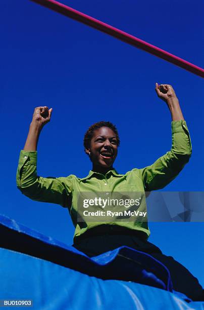 businesswoman celebrating success - womens field event stockfoto's en -beelden