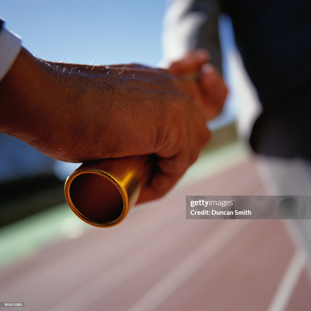 Close-Up of a Baton Hand Off