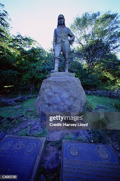 zimbabwe, victoria falls, statue of david livingston, low angle view - david livingston stockfoto's en -beelden