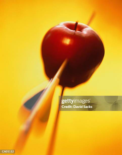 arrow in red apple, close-up - apple arrow stock-fotos und bilder