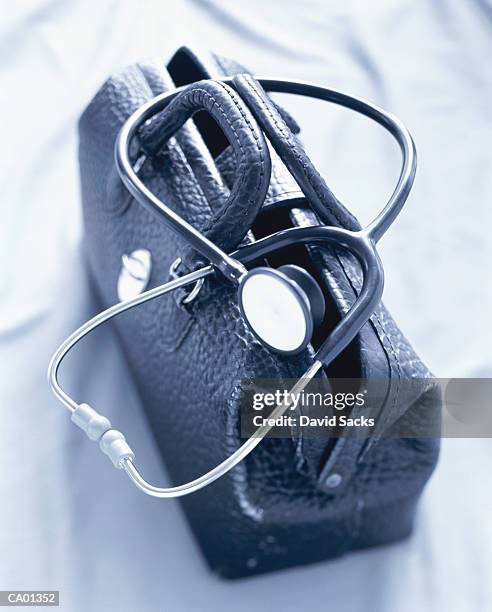 stethoscope on doctor's bag - doctors bag stock pictures, royalty-free photos & images