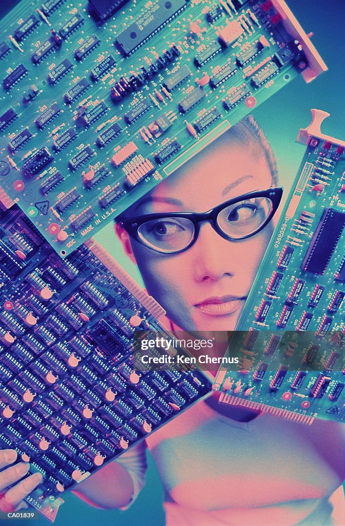 Woman holding circuit boards