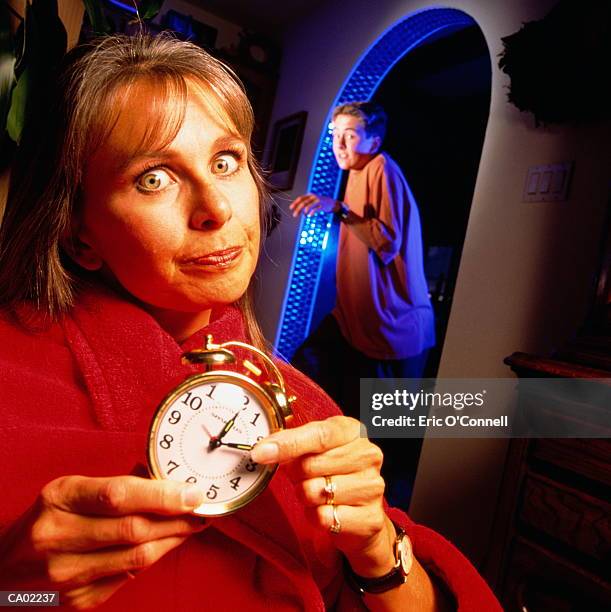 teen boy getting home late upset mum waiting with clock - recolher obrigatório - fotografias e filmes do acervo