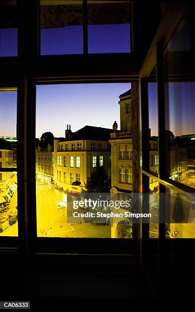 view of town at dusk from hotel window, zurich, switz - kanton zürich stock-fotos und bilder