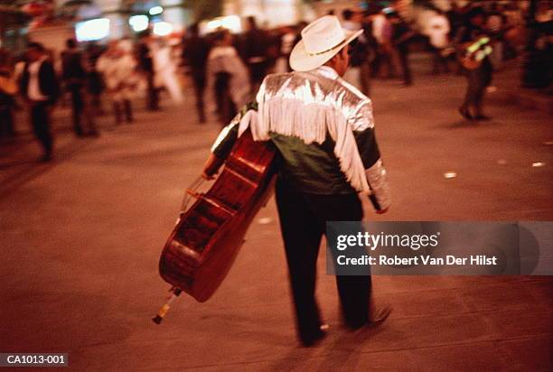 mexico, mexico city, plaza de garibaldi, musician at dusk - latin music stock pictures, royalty-free photos & images