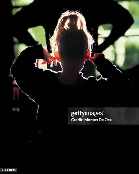 girl (3-5) with fingers in ears - woman fingers in ears stock pictures, royalty-free photos & images