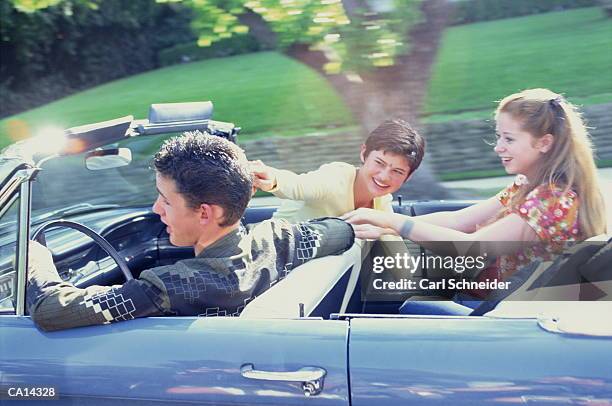 teenages riding in convertible - schneider stock pictures, royalty-free photos & images