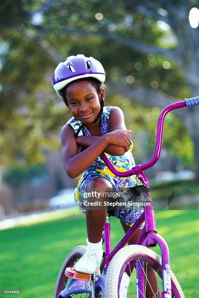 YOUNG GIRL WITH BICYCLE EIGHT YEARS OLD