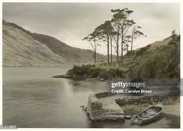 ireland, county mayo, doo lough, rowing boat at edge of lake - county mayo ストックフォトと画像