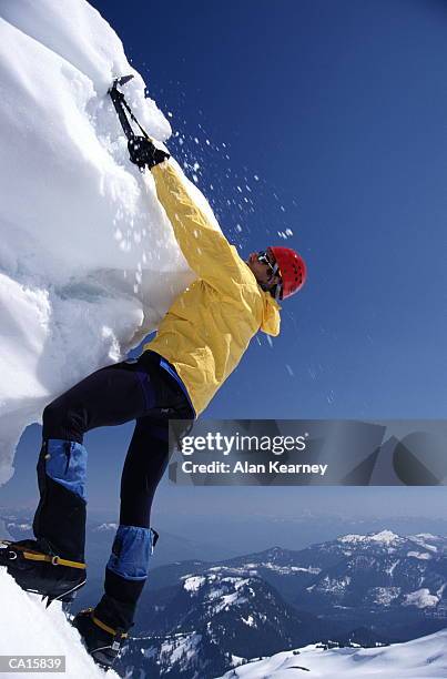 man ice climbing on serac - northern cascade range stockfoto's en -beelden