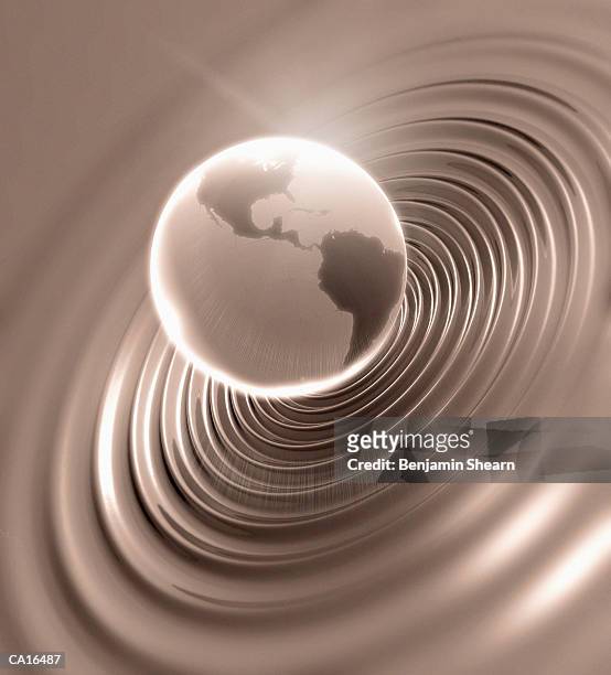 globe making ripples on water (digital composite) - benjamin stock-fotos und bilder
