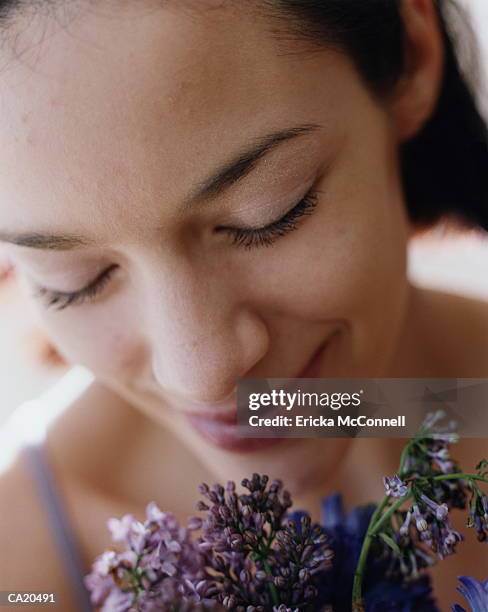 woman with spray of flowers headshot, original - ericka stock pictures, royalty-free photos & images