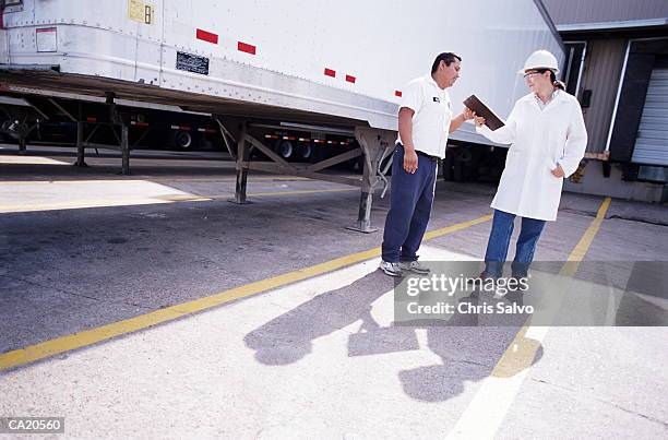 warehouse workers standing by trailer at loading dock - trailer stock pictures, royalty-free photos & images