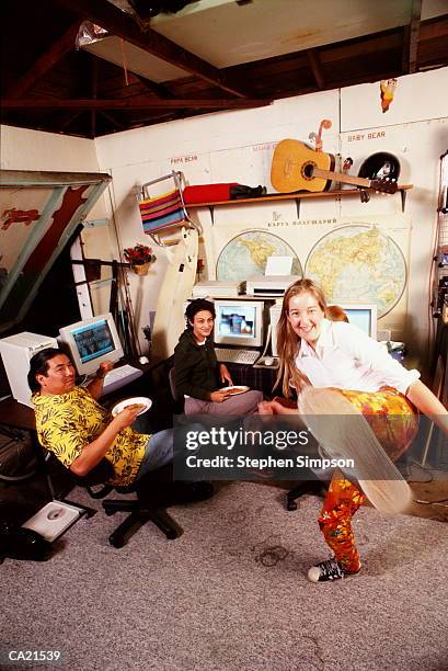 dot com start-up company relaxing in a garage - com imagens e fotografias de stock