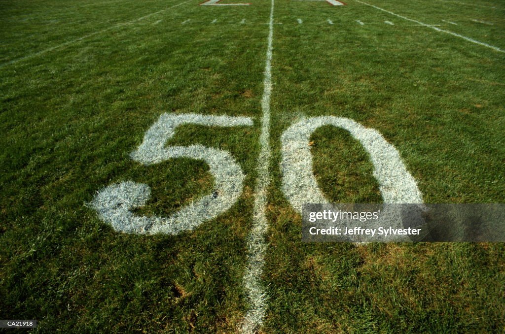 Fifty yard line mark on football field