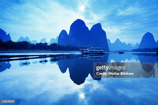 china, guangxi province, steamboat on li river (blue tone) - province stock pictures, royalty-free photos & images