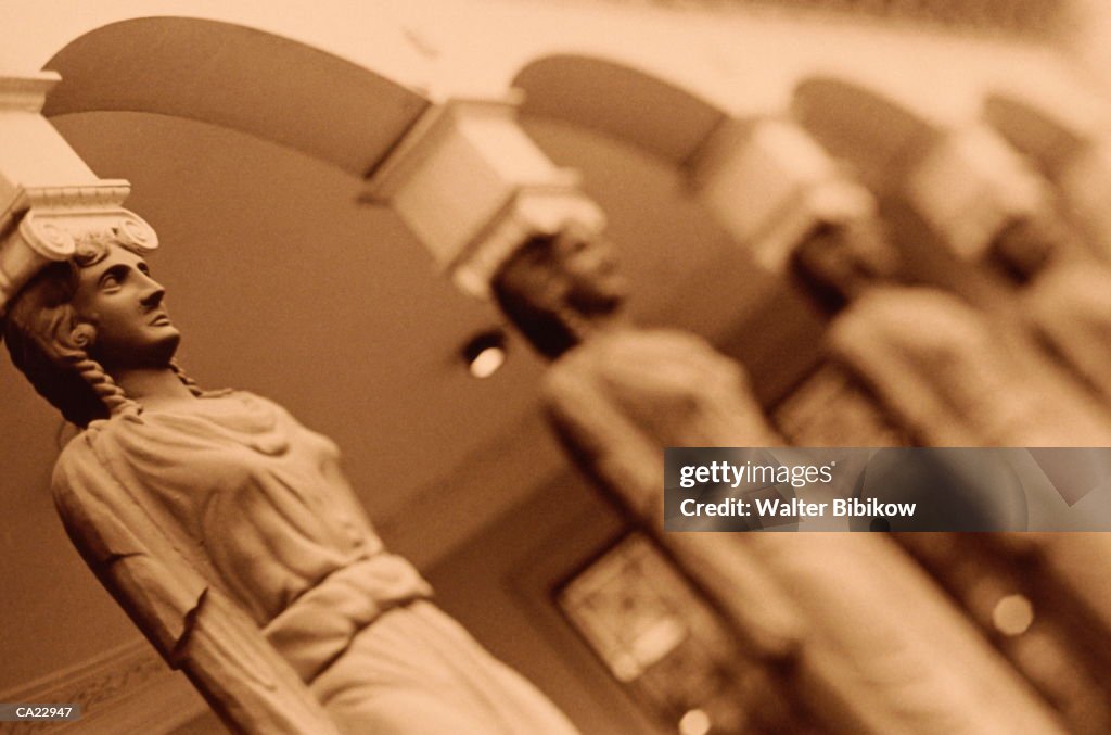 Columns depicting human form (sepia tone)