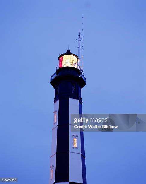 usa, virginia beach, cape henry lighthouse, dusk, low angle view - walter bibikow stock pictures, royalty-free photos & images