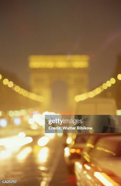 france, paris, arc de triomphe, night (defocussed) - walter bibikow stock pictures, royalty-free photos & images